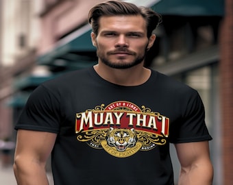 May include: A black t-shirt with a red, gold, and white graphic design featuring a tiger head and the text "Muay Thai - Art of 8 Limbs - Thai Art of Fighting Boxing".