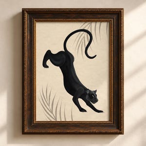 May include: A framed wall art print featuring a black panther in a dynamic leaping pose against a light beige background with subtle gray palm leaf silhouettes. The artwork is enclosed in a dark brown ornate wooden frame with gold trim.