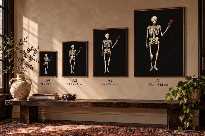 May include: Four framed wall art prints featuring a human skeleton holding a red rose against a black background. The prints are labeled A4 (21 x 29.7 cm), A3 (29.7 x 42 cm), A2 (42 x 59.4 cm), and A1 (59.4 x 84.1 cm) in ascending size order.
