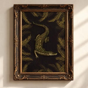 May include: A framed wall art piece featuring a golden alligator illustration centered on a black background, surrounded by golden palm leaf patterns. The artwork is enclosed in an ornate, dark brown, textured wooden frame with carved details.