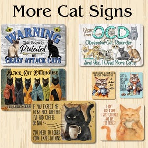 May include: A collection of eight metal signs featuring humorous cat-themed sayings and illustrations. The signs are decorated with colorful images of cats, coffee cups, and other objects. The signs are perfect for adding a touch of humor and personality to any home or office.