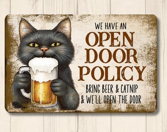 May include: A rectangular metal sign with a vintage look. It features a black cat holding a beer mug with foam. Text reads "WE HAVE AN OPEN DOOR POLICY BRING BEER & CATNIP & WE'LL OPEN THE DOOR."