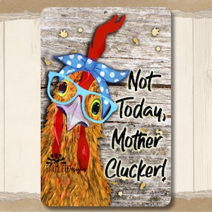 May include: A metal sign with a cartoon illustration of a chicken wearing blue glasses and a blue bandana with white polka dots. The sign has a rustic wood background and the text "Not Today, Mother Clucker!" in black.