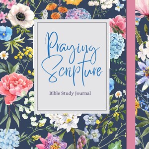 May include: A blue floral patterned journal with the title "Praying Scripture" and the subtitle "Bible Study Journal" in white text.
