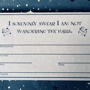 May include: A cream-colored card with the text "I SOLEMNLY SWEAR I AM NOT WANDERING THE HALLS." and lines for Destination, Student, Date, Time, and Teacher. The card has a decorative border and is set against a dark blue background with stars.