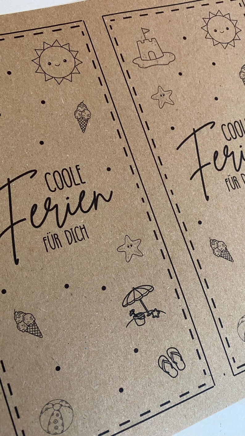 May include: Two brown paper cards with black line art illustrations of beach-themed icons, including a smiling sun, ice cream cones, a sandcastle, and a beach umbrella. The text "COOLE Ferien F&Uuml;R DICH" is written in a script font.