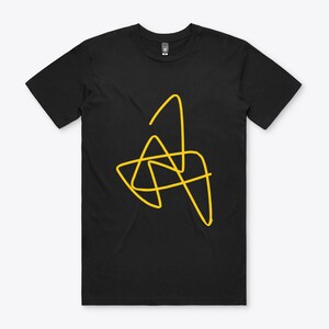 May include: Black t-shirt with a yellow abstract design.