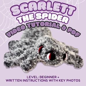 May include: A plush spider toy with fuzzy black and white yarn, featuring prominent red and black eyes. The text reads SCARLETT THE SPIDER VIDEO TUTORIAL & PDF and LEVEL: BEGINNER + WRITTEN INSTRUCTIONS WITH KEY PHOTOS against a light purple background.