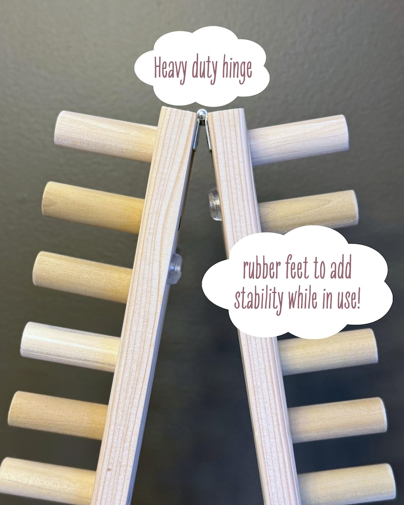 foldable chunky knit blanket loom 50” showing heavy duty hinge at folding point. rubber feet to add stability while in use.
