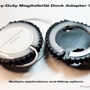 May include: Two black and white MagSafe/Qi Dock Adapter Shells. The shells have a circular design with a white interior and a black, gear-like outer edge. The text "Heavy-Duty MagSafe/Qi Dock Adapter Shell" and "Multiple applications and fitting options" are visible.