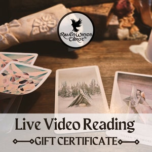 May include: A gift certificate for a live video tarot reading from Raven Winds Tarot. The certificate features a graphic of tarot cards and the text "Live Video Reading" and "Gift Certificate".