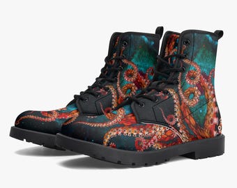 May include: A pair of ankle-high lace-up boots featuring a vibrant graphic print of orange and red octopus tentacles winding across a dark teal and black background. The boots have black laces, black eyelets, and a thick black rubber sole.