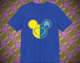 May include: A royal blue t-shirt with a yellow and blue Mickey Mouse silhouette. The silhouette has a heart shape in the middle, with the yellow half of the heart on the left and the blue half on the right. The Mickey Mouse ears have a yellow outline and a blue interior.