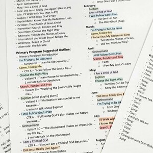 May include: A printed document titled New Testament Singing Time Plan for the Year, featuring a list of songs organised by month, a primary programme suggested outline, and colour-coded highlights for specific song titles on white paper.