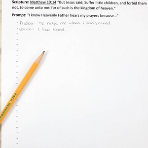 May include: A white paper sheet titled Fill-in Parts Outline &ndash; A Child&rsquo;s Prayer with printed text including Matthew 19:14 and a prompt. Two handwritten lines are present, and a yellow Dixon Ticonderoga pencil rests diagonally across the left side.