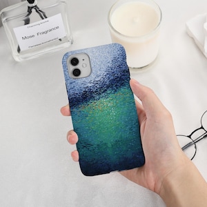 May include: A smartphone case with a colorful abstract design. The case features a textured pattern with shades of blue, green, and a touch of orange. The case is designed to fit a smartphone with a dual-lens camera.