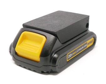May include: A black and yellow 20V MAX Lithium Ion battery pack. The battery has a yellow release button and the brand name "DEWALT" is visible. The battery is designed for power tools.