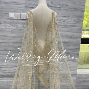 Sheer gold cape shop