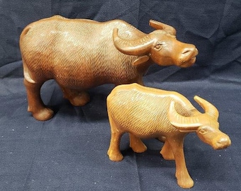 Hand Carved Wooden Bull Figurines: Collectible Longhorn Decor