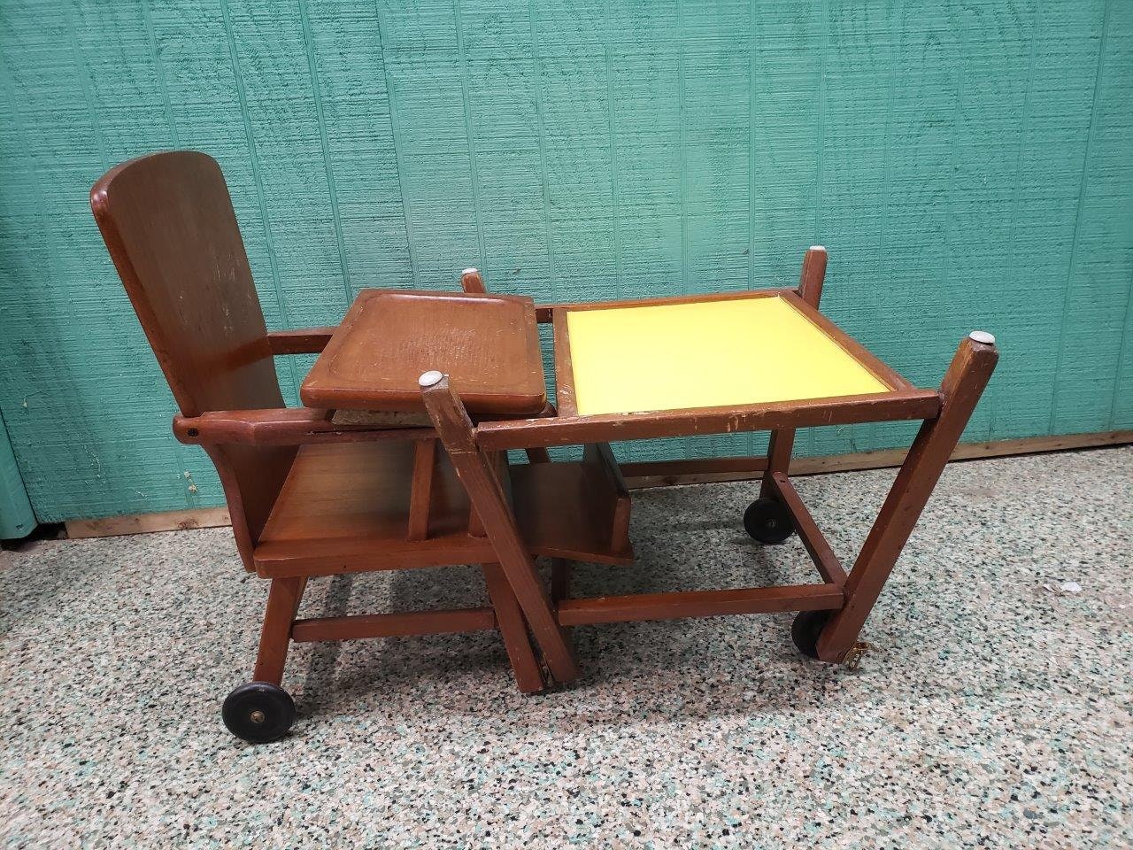 Vintage Wooden High-chair/desk Hybrid on Rollers With Yellow Vintage Wooden High-chair/desk Hybrid on Rollers With Yellow