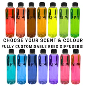 May include: A selection of colourful glass bottles with the text "MOB COSMETICS" on the label. The bottles are arranged in two rows of seven. The text "CHOOSE YOUR SCENT & COLOUR FULLY CUSTOMISABLE REED DIFFUSERS!" is displayed below the bottles.