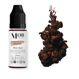 May include: A 10 ml bottle of MOB Cosmetics Chocolate Brown Wax Dye. The bottle is clear with a black cap and a white label. The label has the MOB Cosmetics logo, the product name, and instructions for use.