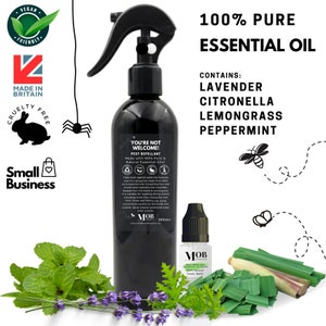 May include: A black spray bottle labelled "You're Not Welcome! Pest Repellant" with a list of essential oils including lavender, citronella, lemongrass, and peppermint. The bottle is 250 ml and is made with 100% pure and natural essential oils. The bottle is surrounded by various herbs and plants, including lavender, lemongrass, and mint.