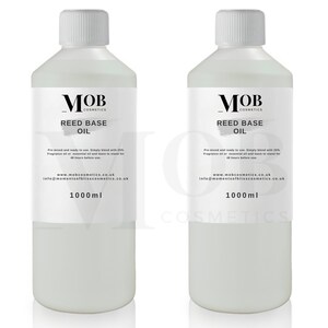 May include: Two clear plastic bottles with white labels. The labels have black text that reads "MOB Cosmetics Reed Base Oil". The bottles contain 1000 ml of oil.