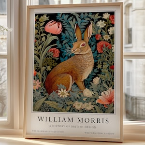 May include: A framed print of a brown rabbit sitting in a field of flowers. The print is titled "William Morris, A History of British Design, The Mammals Collection, Walthamstow, London."
