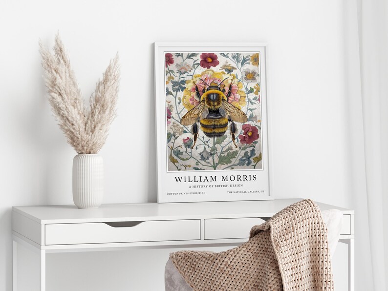 May include: A framed print of a bee surrounded by flowers. The print is titled "William Morris: A History of British Design".