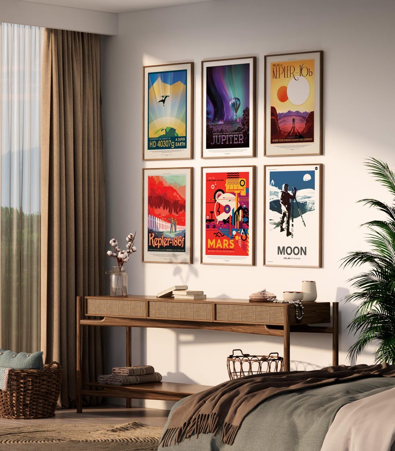 May include: Six framed posters with colorful illustrations of planets and space exploration. The posters are hung on a white wall in a modern living room setting. The posters feature the text "Kepler-186f", "Jupiter", "Mars", "Moon", "HD 40307g", and "Kepler-10b".