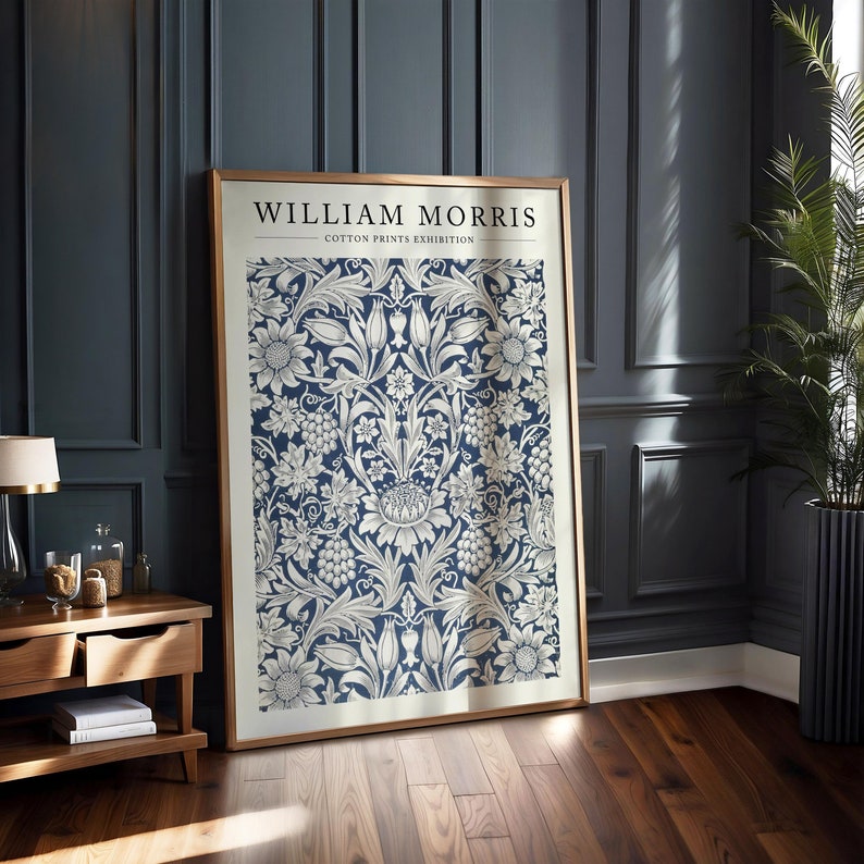William Morris Blue Floral Pattern Print featuring intricate botanical motifs in blue and cream tones. This Art Nouveau-inspired textile print adds vintage elegance to home decor, making it perfect for any living room, bedroom, or office space.