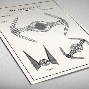 May include: A black and white line drawing of a TIE Advanced X1 starfighter, a fictional spacecraft from the Star Wars universe. The drawing is labeled "TIE Advanced X1" and includes the patent number "No. 978,431".