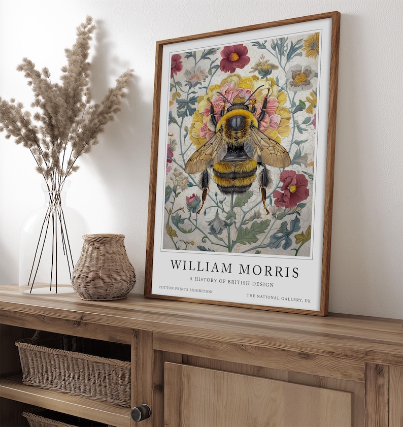 May include: A vintage poster featuring a bee surrounded by colorful flowers. The poster is titled "William Morris: A History of British Design" and includes the text "Cotton Prints Exhibition" and "The National Gallery, UK".