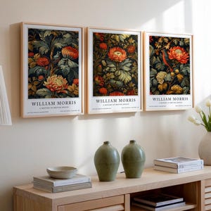 William Morris Bird & Floral Print featuring intricate orange flowers and lush green foliage with a small bird perched among the leaves. This vintage botanical print adds vibrant nature-inspired beauty to any room, ideal for wall décor or gifting