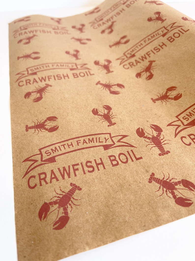 May include: Brown paper with a repeating pattern of red crawfish and the text "Smith Family Crawfish Boil".