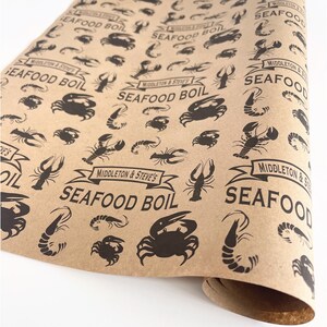 May include: Brown paper wrapping paper with a repeating pattern of black crabs, shrimp, and lobsters. The paper has the text "Middleton & Steve's Seafood Boil" repeated throughout.