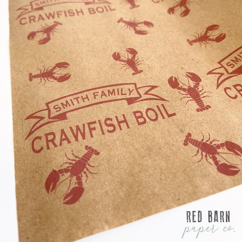 May include: Brown paper bag with a red design of crawfish and the text "Smith Family Crawfish Boil". The bag also has the text "Red Barn Paper Co."