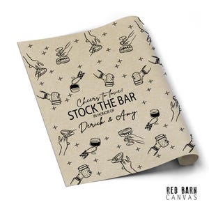 May include: Tan paper with a repeating black line drawing pattern of hands holding various cocktail glasses and bar tools. Text reads "Cheers to love! Stock the Bar in honor of Derick & Amy."