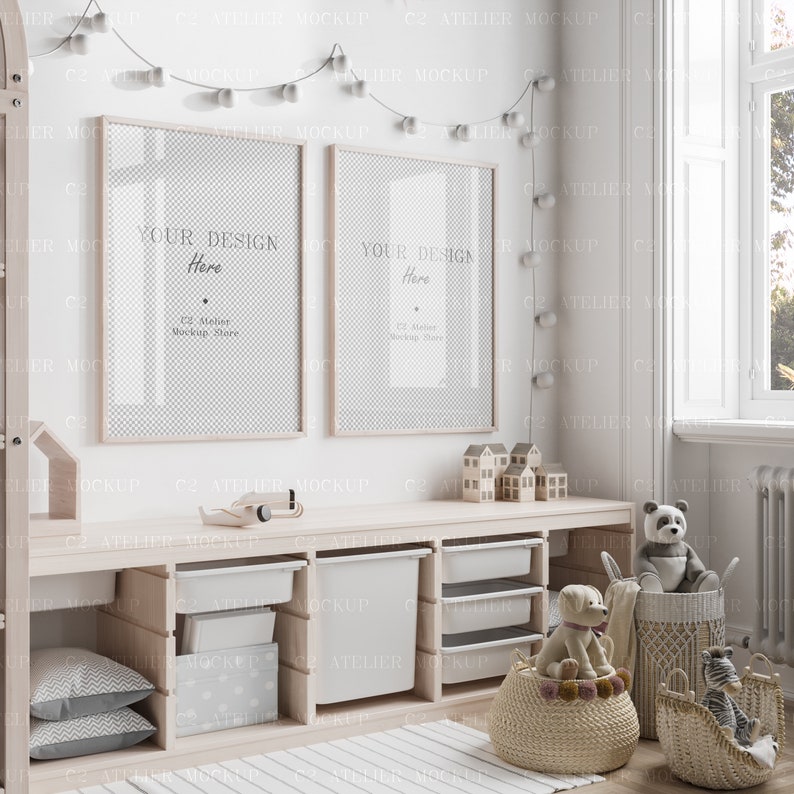 May include: A white wooden shelf unit with two empty picture frames, a toy airplane, and a variety of toy storage bins. The shelf unit is against a white wall with a string of white lights hanging above it. There are also stuffed animals and a basket of toys on the floor.