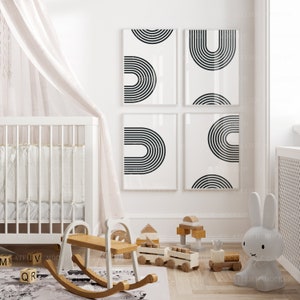 May include: A white cot with a white canopy and a wooden rocking horse in a nursery with black and white geometric wall art. There are wooden toys on the floor, including a train and blocks.