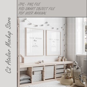 May include: Two white picture frames with the text "Your Design Here" hanging on a white wall above a white wooden shelf with storage bins and toy baskets. The shelf is decorated with a string of white lights and toys.