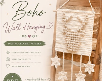 May include: A digital crochet pattern for a square wall hanging featuring a textured bobble-stitch deer head design in cream yarn. Five crocheted stars hang from the bottom edge. The text reads Boho Wall Hanging, Digital Crochet Pattern, PDF Download.