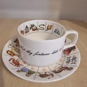 Taza y platillo de adivinación Royal Kendal: juego de hojas de té para adivinación, astrología y zodíaco de porcelana fina, fabricado en Inglaterra.