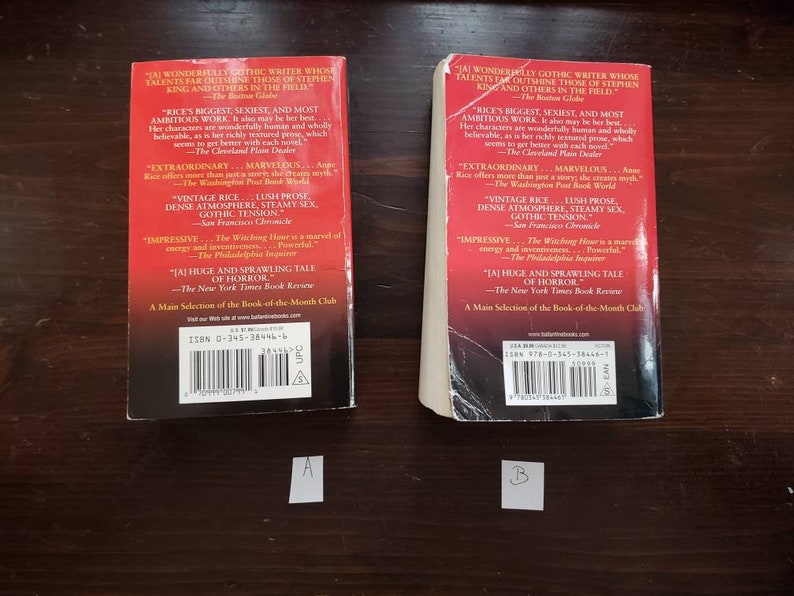 May include: Two red paperback books with white text on the spine and back cover. The books are titled "The Witching Hour" by Anne Rice. The back cover includes quotes from reviews and the ISBN number.