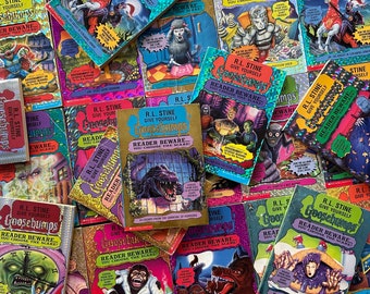 May include: A pile of Goosebumps books by R.L. Stine. The books have colorful covers with illustrations of monsters, creatures, and spooky scenes. The text on the covers reads "Give Yourself Goosebumps" and "Reader Beware... You Choose the Scare!"