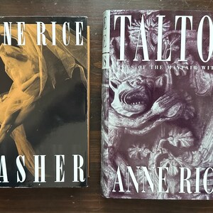 May include: Two paperback books by Anne Rice. The book on the left is titled "Lasher" and features a black and white photo of a woman in a flowing gown. The book on the right is titled "Talisman" and features a black and white photo of a gargoyle.