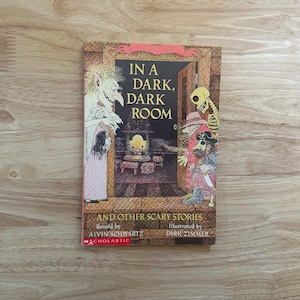In A Dark Dark Room and Other Scary Stories by Alvin Schwartz Illustrated by Dirk Zimmer Vintage Scholastic Books Twenty Third Printing 1991
