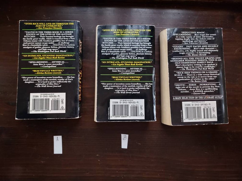 May include: Three paperback books with black covers and white text. The books are titled "Taltos" by Anne Rice. The back covers feature quotes about the book and author. The ISBN numbers are visible on the back covers.