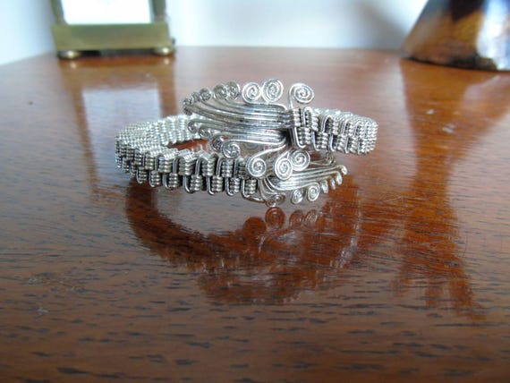 Two Bracelets. Silver thin wavy bangle, and maybe… - image 1